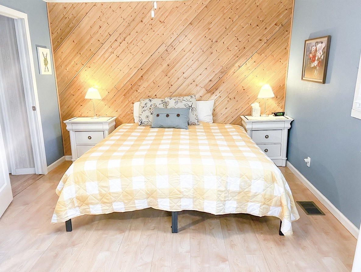 3745 Holmes Creek Road Smithville, TN 37166 - Photo 19 of 23 a large bed sitting in a bedroom next to a window