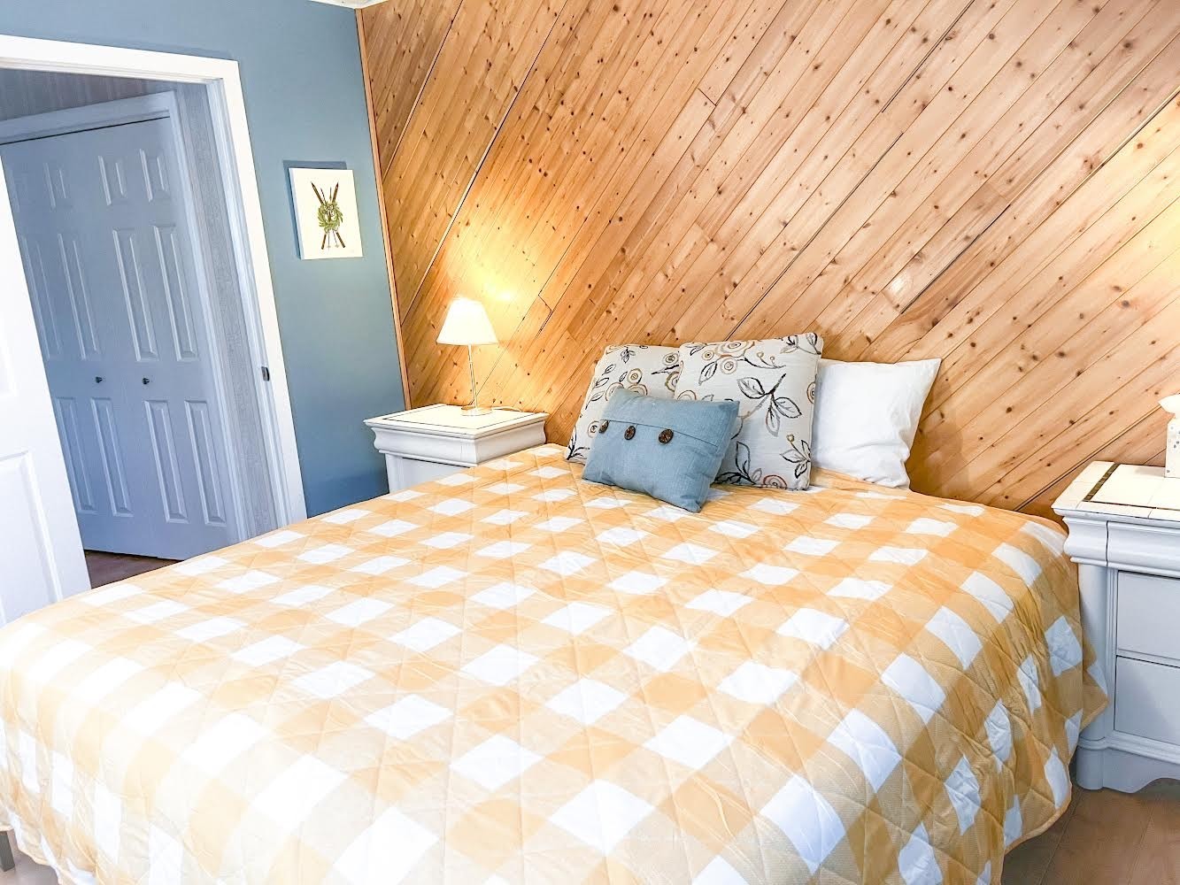 3745 Holmes Creek Road Smithville, TN 37166 - Photo 20 of 23 a large bed sitting in a bedroom next to a wooden door