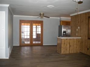 617 Laura Street Mansfield, LA 71052 - Photo 2 of 9 a view of an empty room with wooden floor and a window
