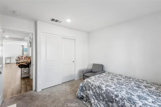 a bedroom with a bed and a view of bathroom