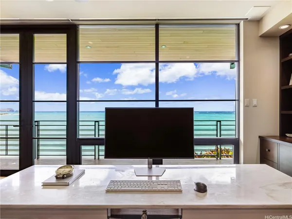 a room with a large window and a flat screen tv