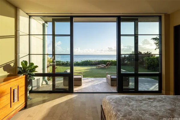 a view of a living room and a large window