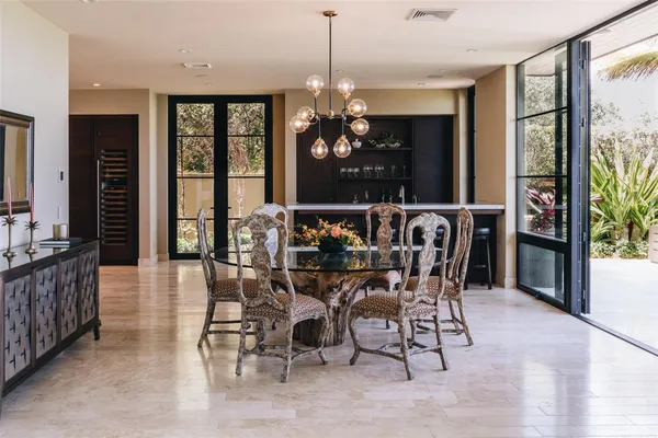 a view of a dining room with furniture window and outside view