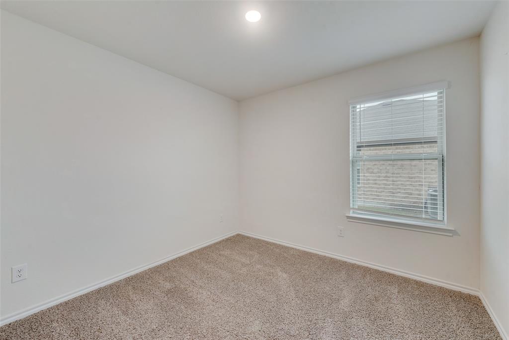 1413 Thunder Cyn Way Royse City, TX 75189 - Photo 14 of 24 an empty room with a window