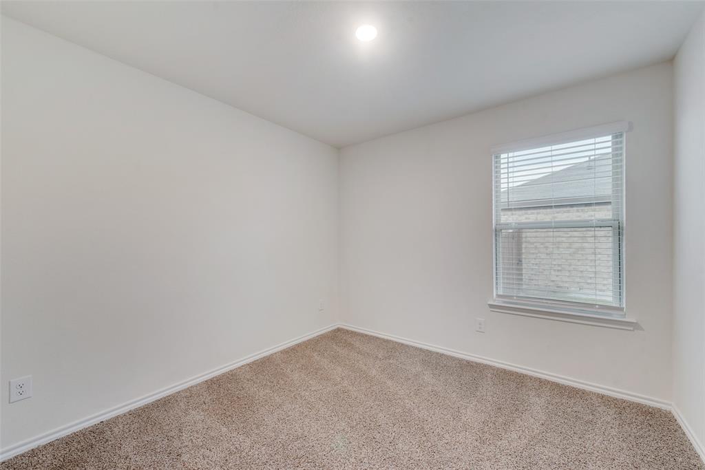 1413 Thunder Cyn Way Royse City, TX 75189 - Photo 22 of 24 an empty room with a window