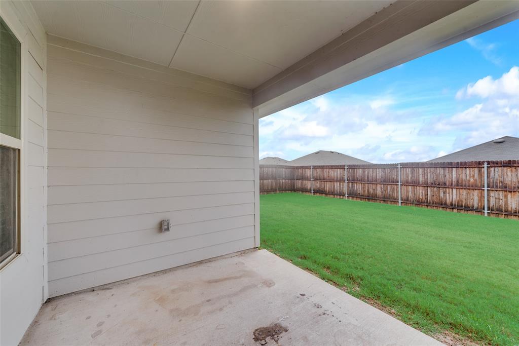 1413 Thunder Cyn Way Royse City, TX 75189 - Photo 23 of 24 a view of a backyard with wooden fence