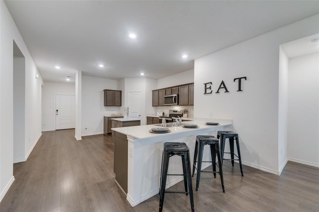 1413 Thunder Cyn Way Royse City, TX 75189 - Photo 4 of 24 a view of a dining room with furniture