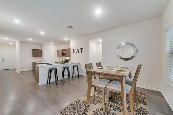 a view of a dining room with furniture