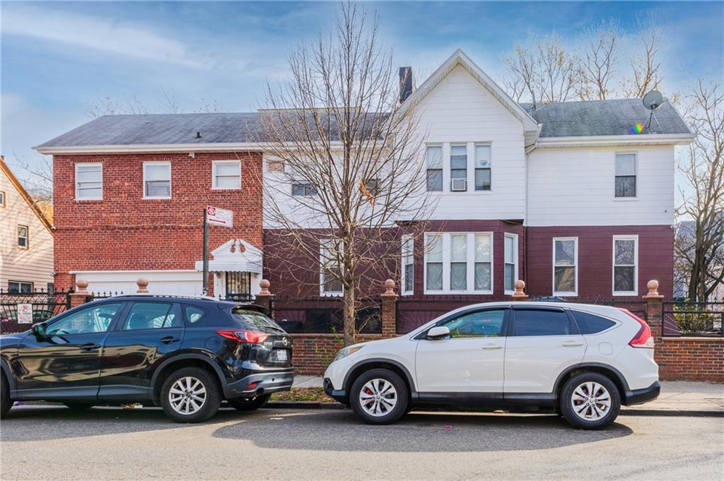 1027 Bushwick Avenue Brooklyn, NY 11221 - Photo 3 of 10 a front view of a house with parking space