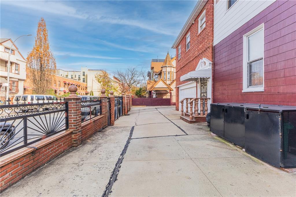 1027 Bushwick Avenue Brooklyn, NY 11221 - Photo 6 of 10 a view of a brick house with a balcony