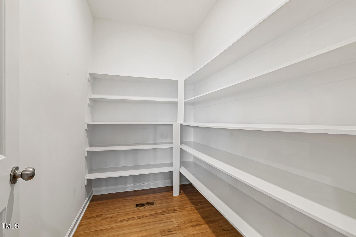 143 Rossell Park Circle Garner, NC 27529 - Photo 12 of 42 a view of walk in closet with empty racks