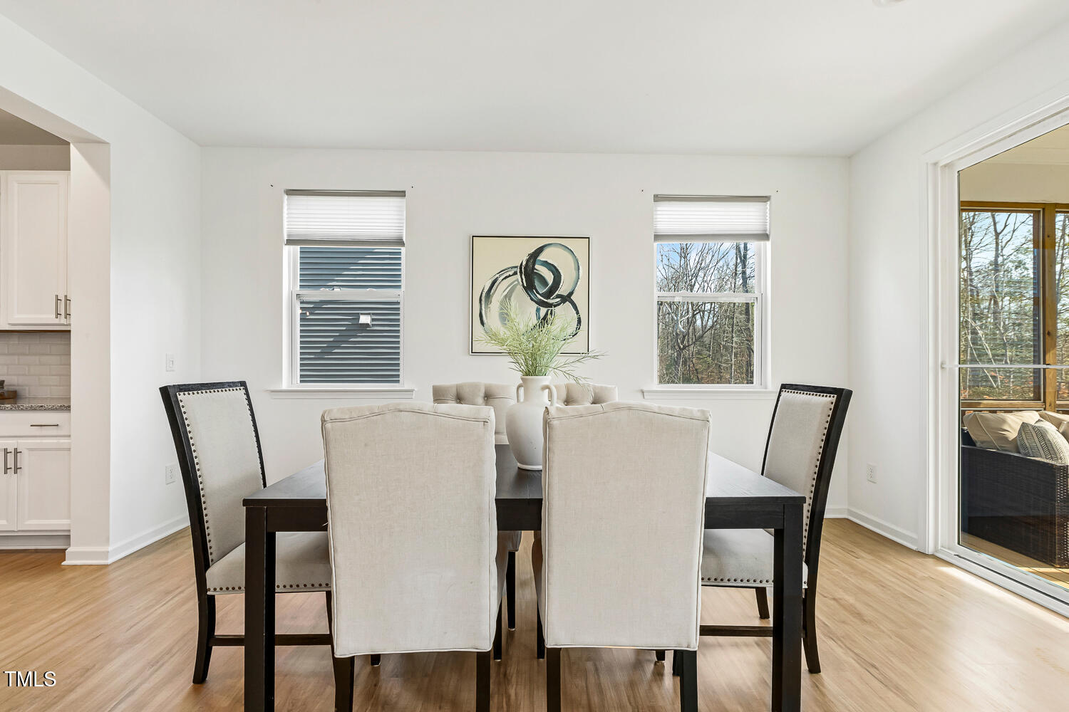 143 Rossell Park Circle Garner, NC 27529 - Photo 16 of 42 a view of a dining room with furniture window and wooden floor