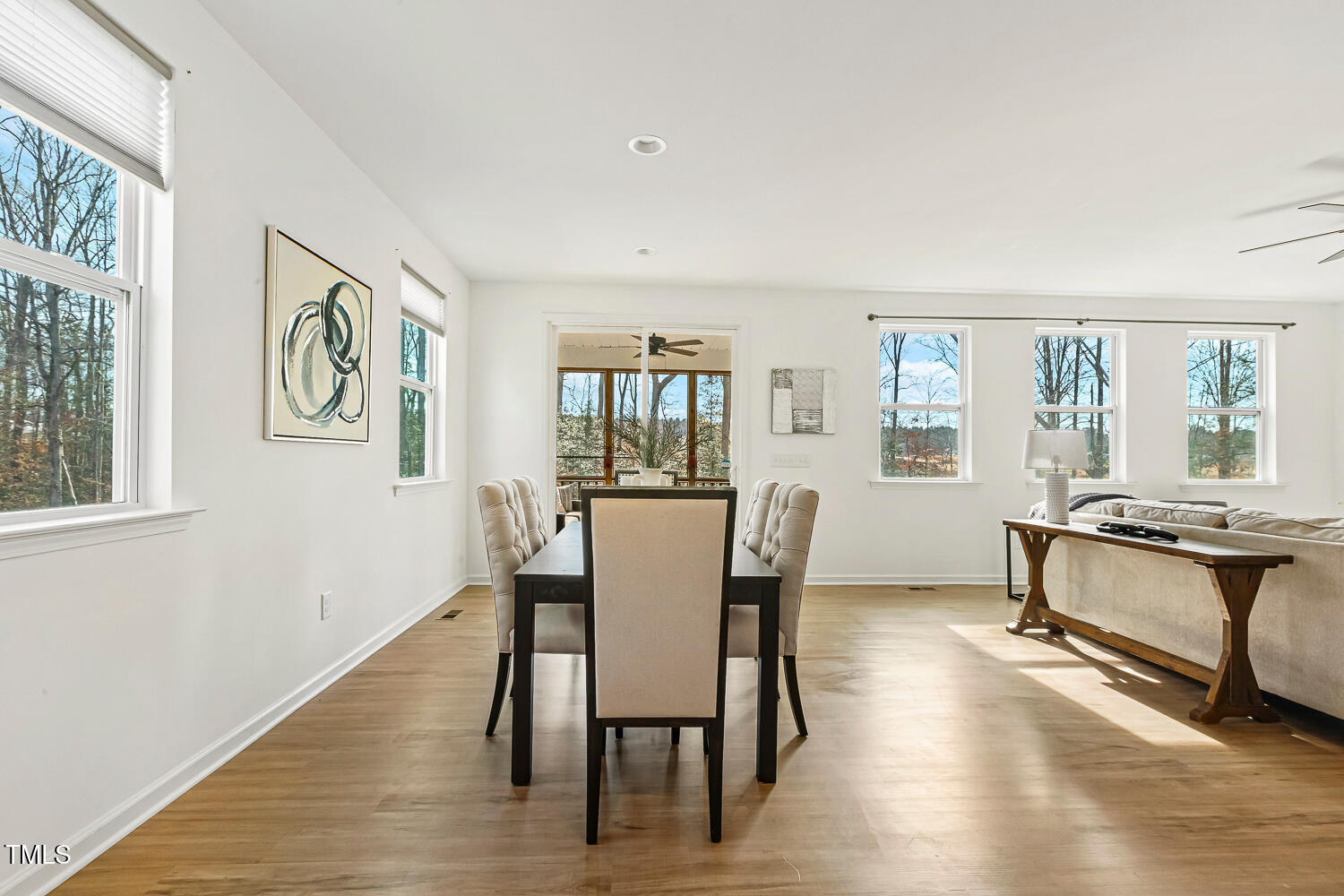 143 Rossell Park Circle Garner, NC 27529 - Photo 17 of 42 a view of a dining room with furniture window and wooden floor