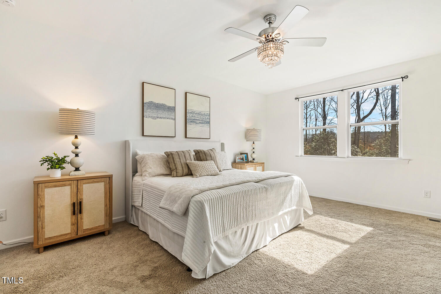 143 Rossell Park Circle Garner, NC 27529 - Photo 20 of 42 a bedroom with a bed and a painting on the wall