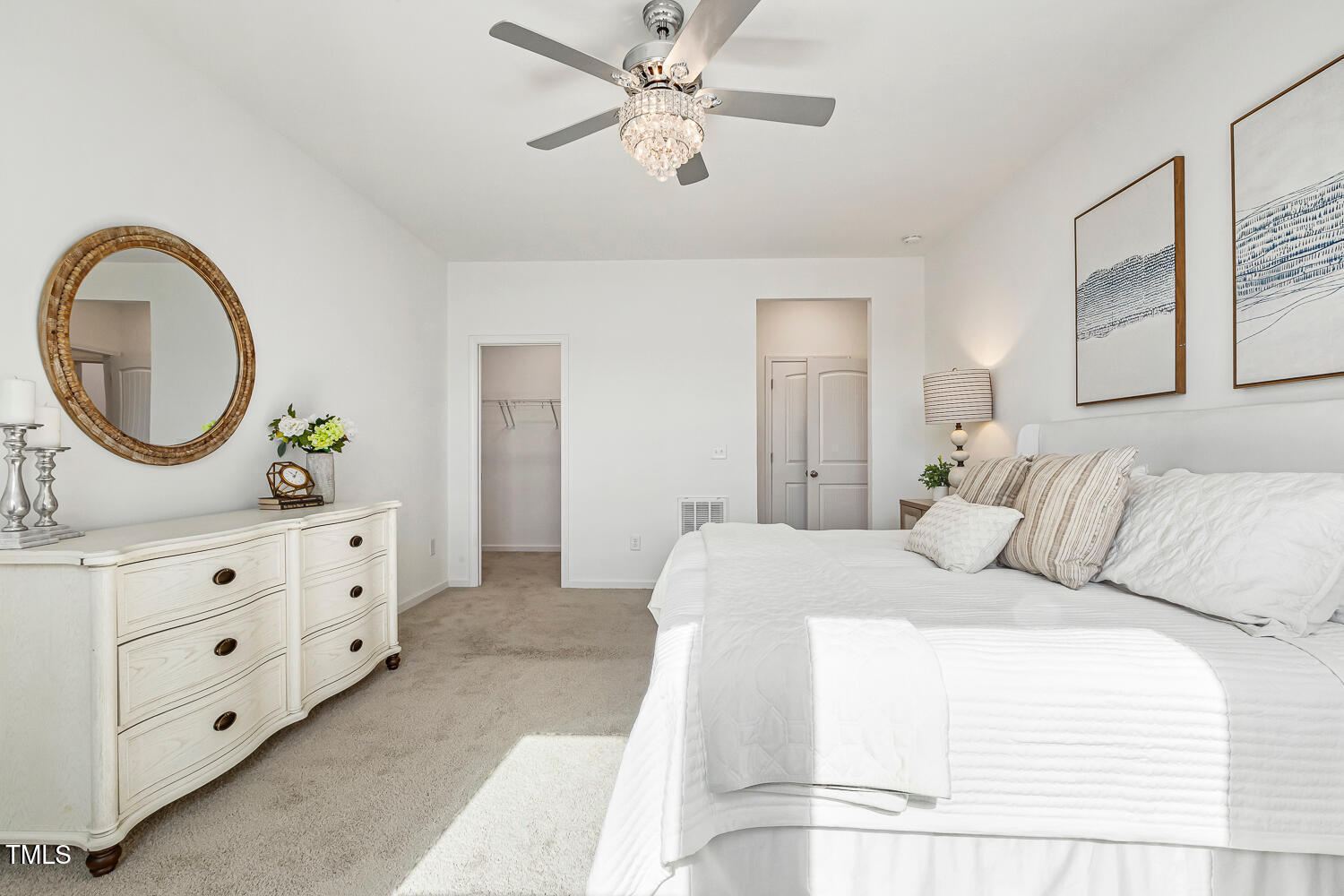 143 Rossell Park Circle Garner, NC 27529 - Photo 21 of 42 a bedroom with a bed and a dresser