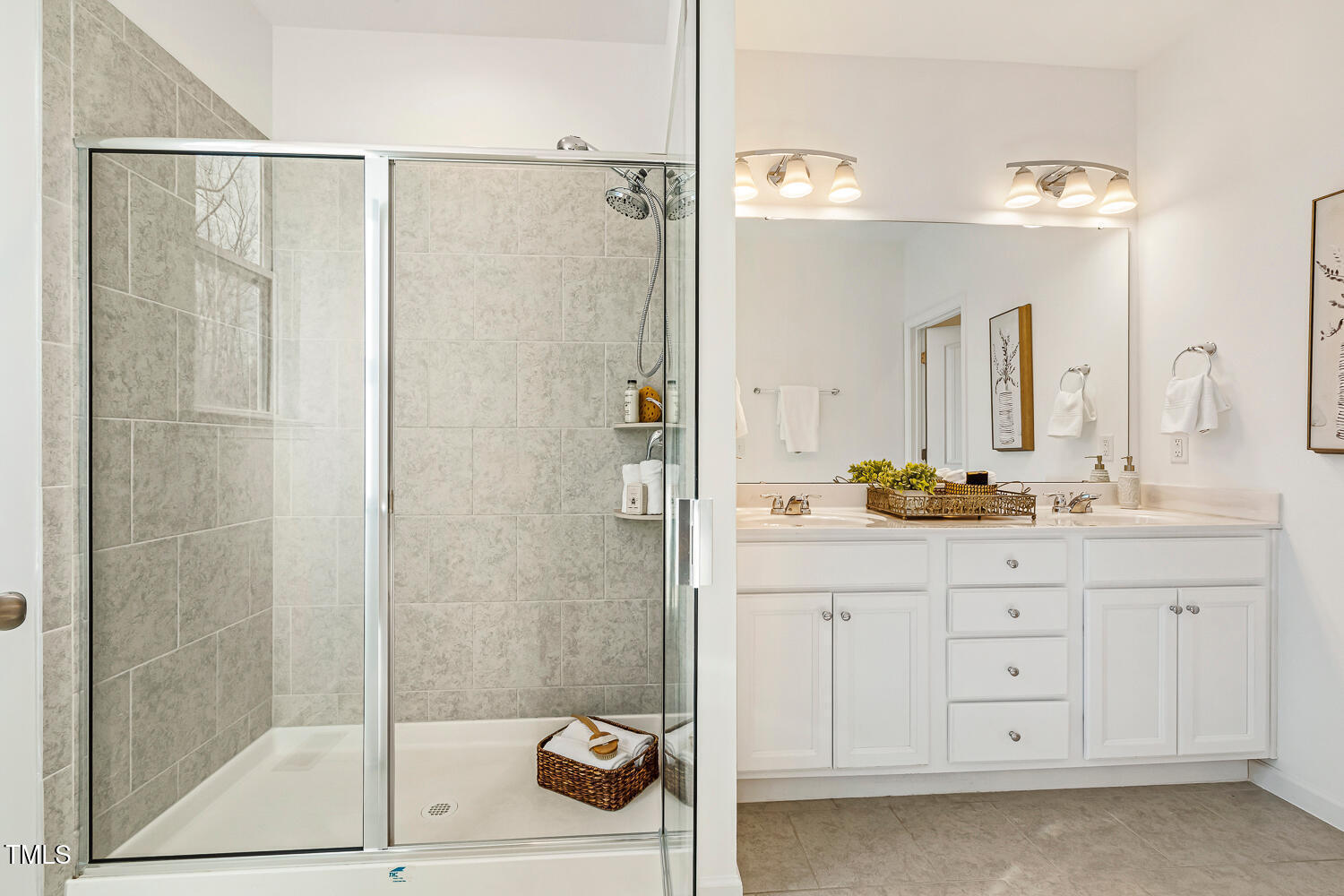 143 Rossell Park Circle Garner, NC 27529 - Photo 22 of 42 a bathroom with a shower sink and mirror