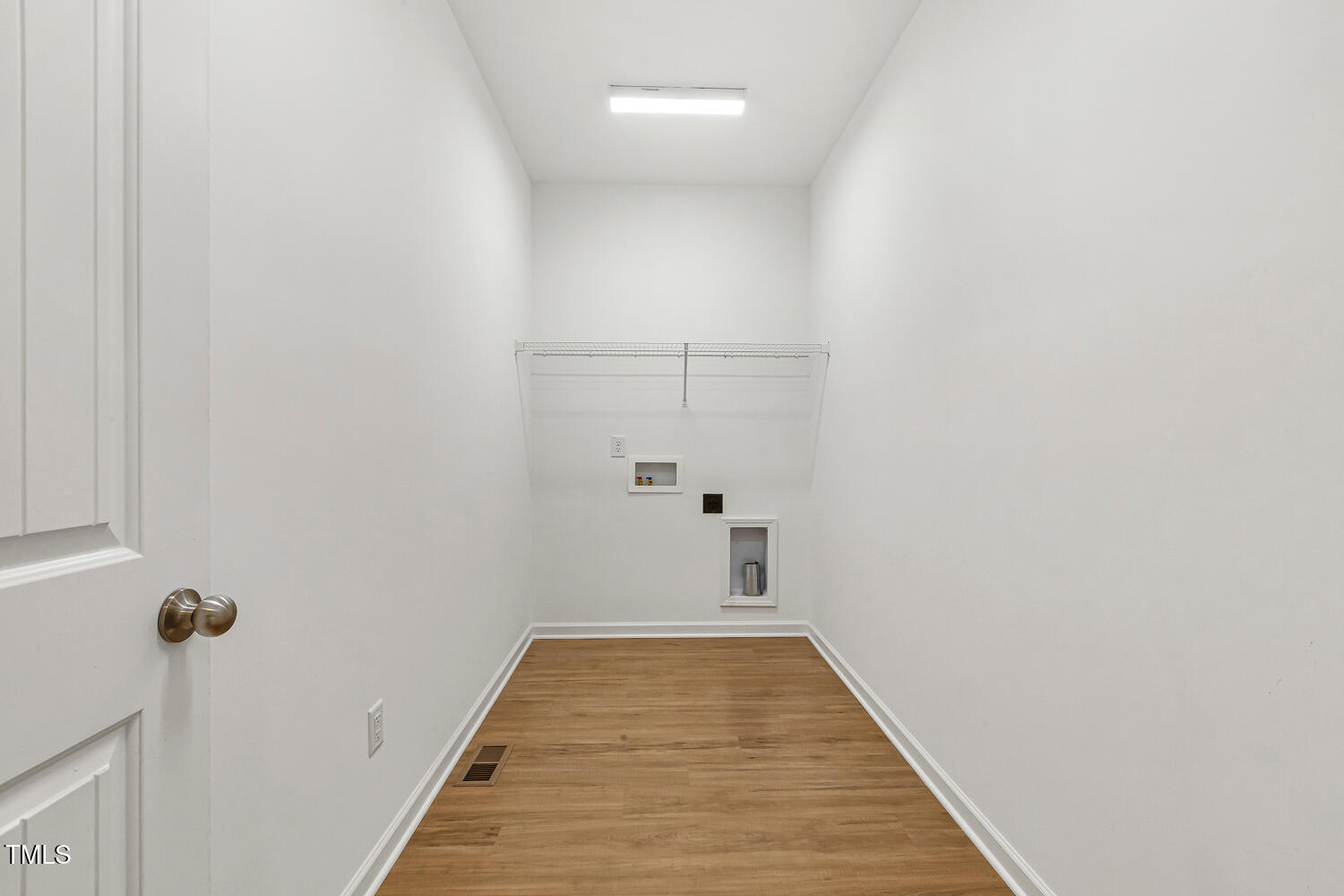 143 Rossell Park Circle Garner, NC 27529 - Photo 25 of 42 a view of a hallway with wooden floor