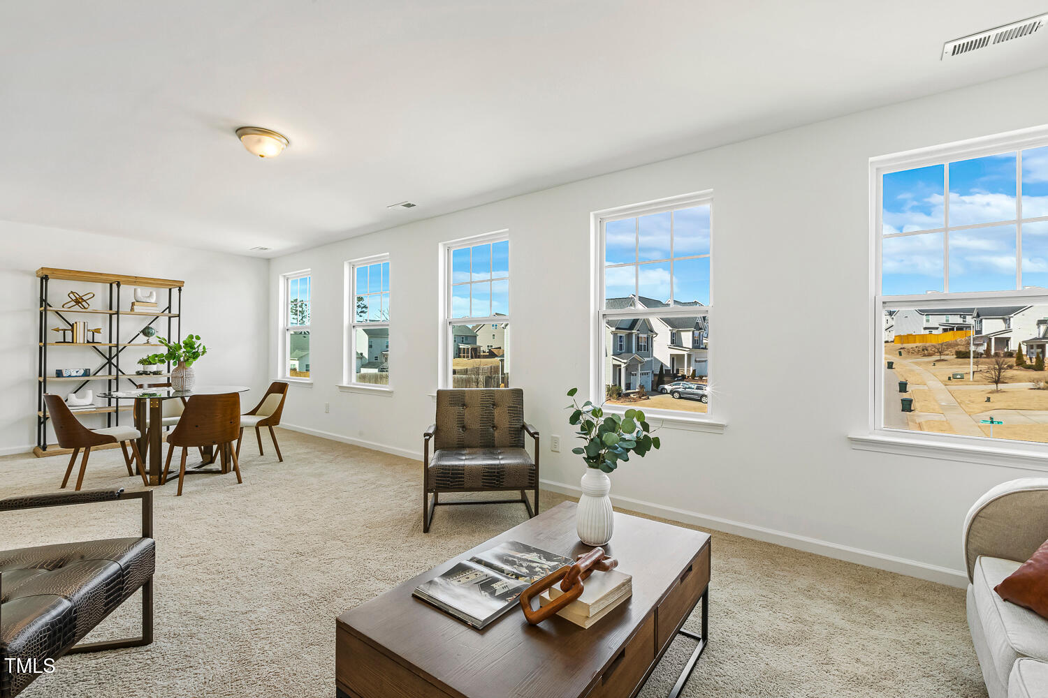 143 Rossell Park Circle Garner, NC 27529 - Photo 28 of 42 a living room with furniture and a table