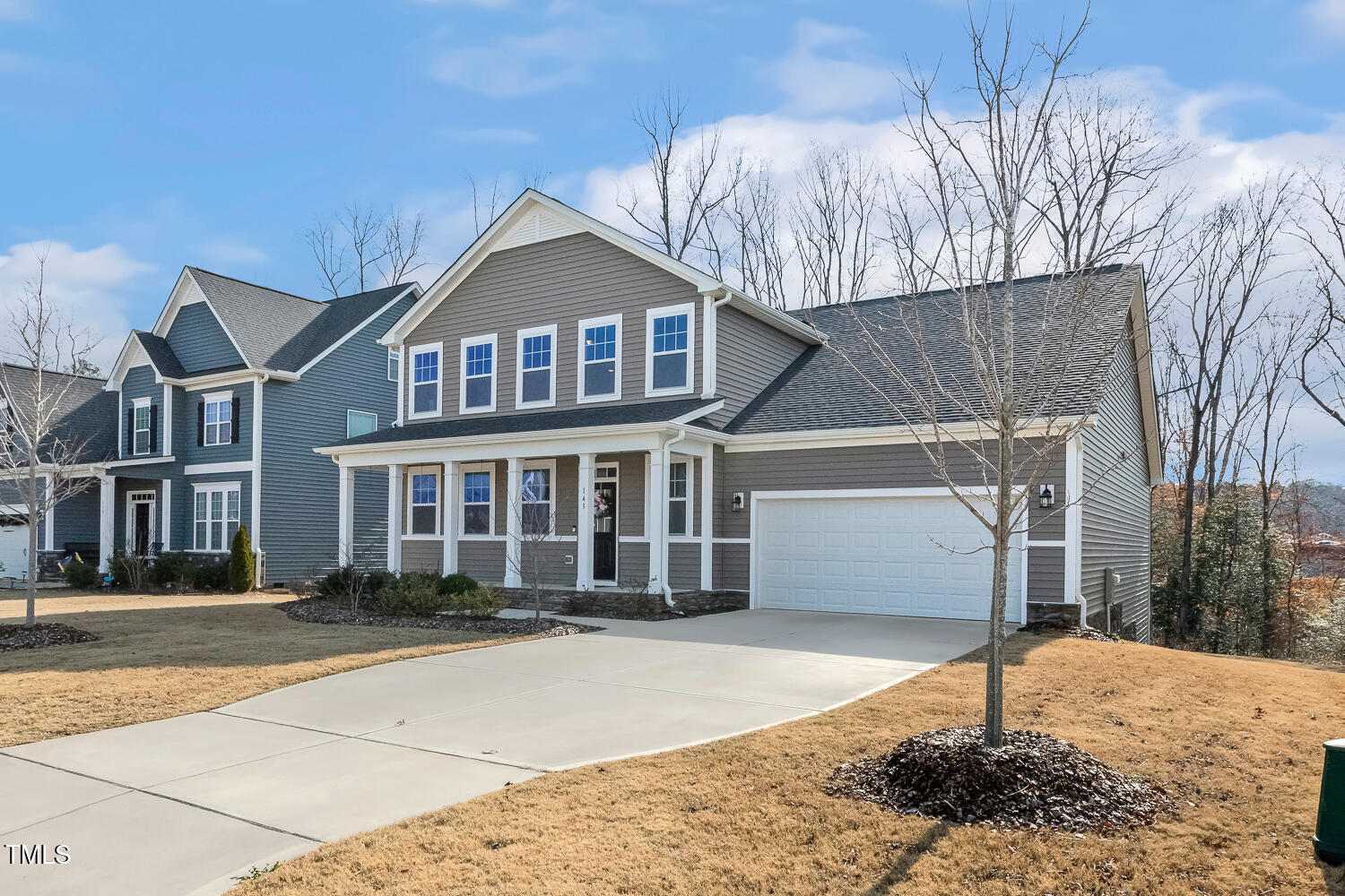 143 Rossell Park Circle Garner, NC 27529 - Photo 2 of 42 a front view of a house with a yard