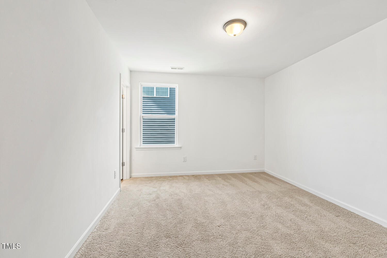 143 Rossell Park Circle Garner, NC 27529 - Photo 30 of 42 an empty room with a empty space and a window