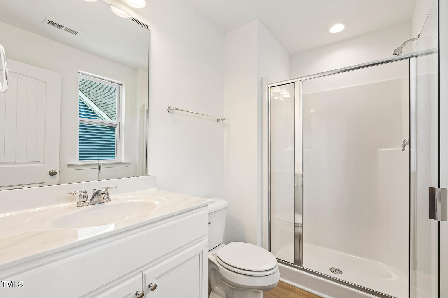 143 Rossell Park Circle Garner, NC 27529 - Photo 32 of 42 a bathroom with a sink toilet vanity and shower
