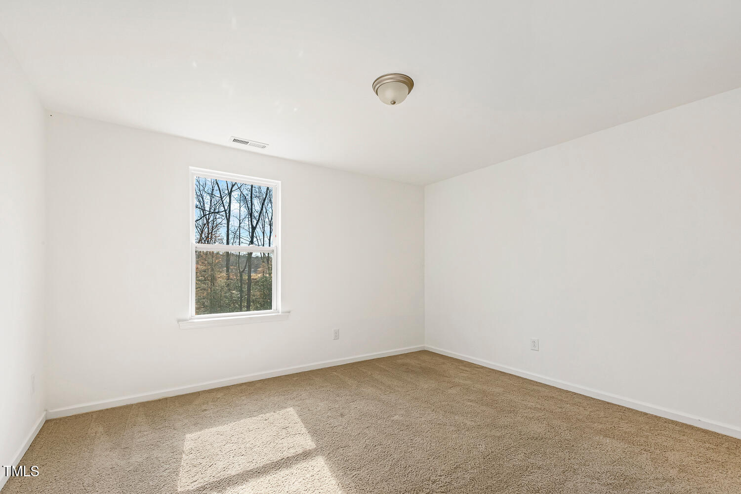 143 Rossell Park Circle Garner, NC 27529 - Photo 33 of 42 an empty room with a window