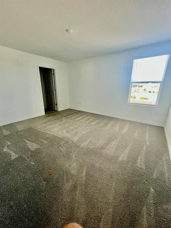 9023 Bay Leaf Drive Parrish, FL 34219 - Photo 21 of 31 a view of an empty room with a window