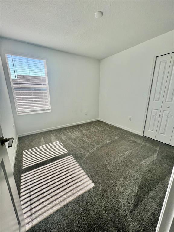9023 Bay Leaf Drive Parrish, FL 34219 - Photo 26 of 31 a view of a room with wooden floor and cabinet