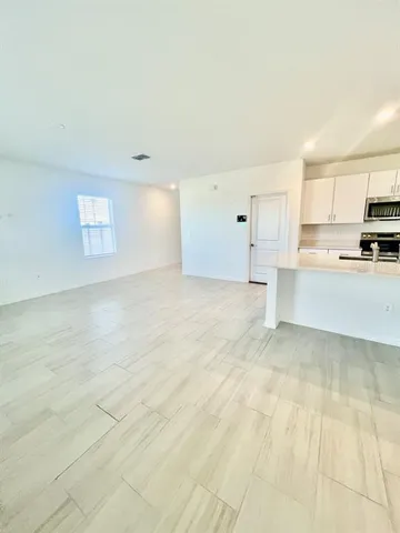 a view of a kitchen with a sink