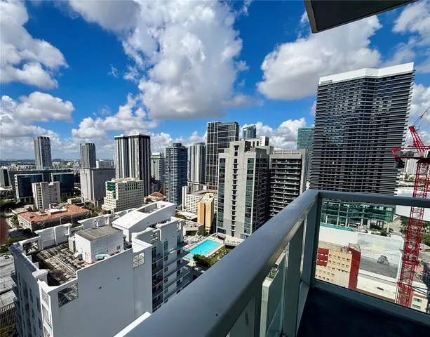 a view of a living room and kitchen