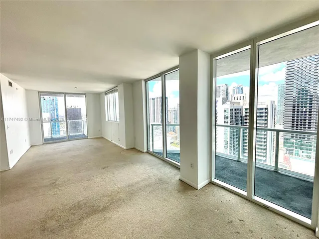 a spacious bathroom with a tub sink and mirror
