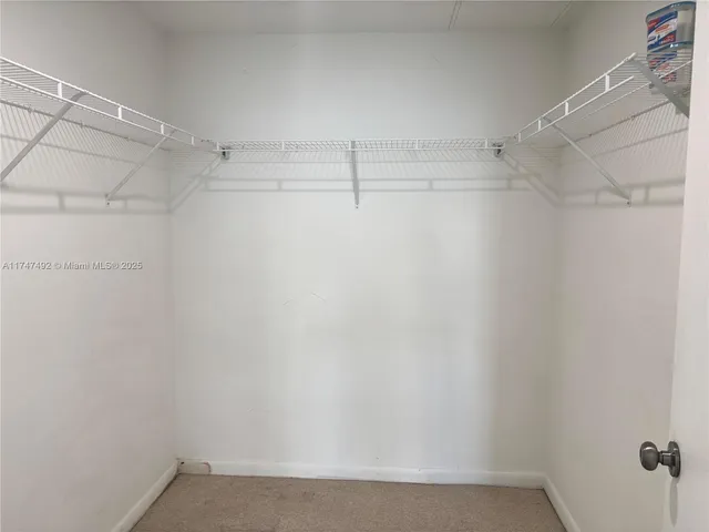 a bathroom with a toilet sink and shower