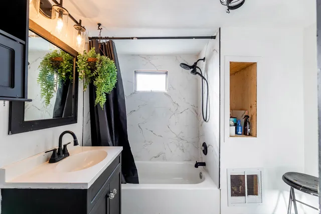 a view of entryway with window and wooden floor