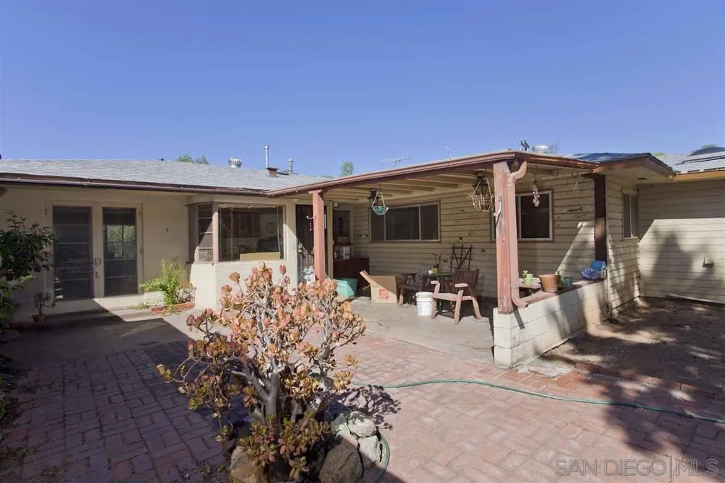 1950 Valley Rim Road El Cajon, CA 92019 - Photo 8 of 10 a front view of house with yard outdoor seating and barbeque oven