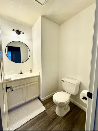 a bathroom with a toilet and a sink