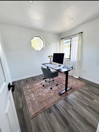 a workspace with furniture and window