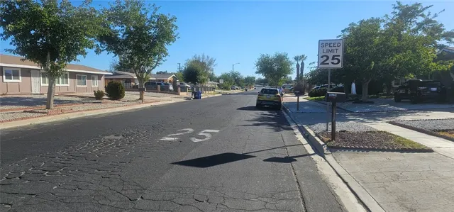 a view of street with parked cars