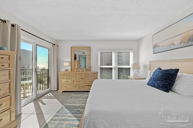 a bathroom with a sink a toilet a mirror and shower