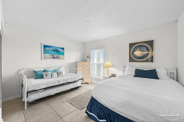 a view of a balcony with table and chairs