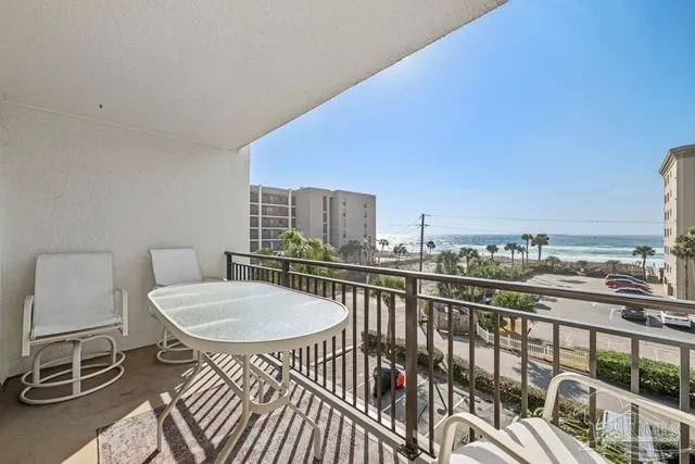 a bathroom with a granite countertop sink mirror and a bathtub