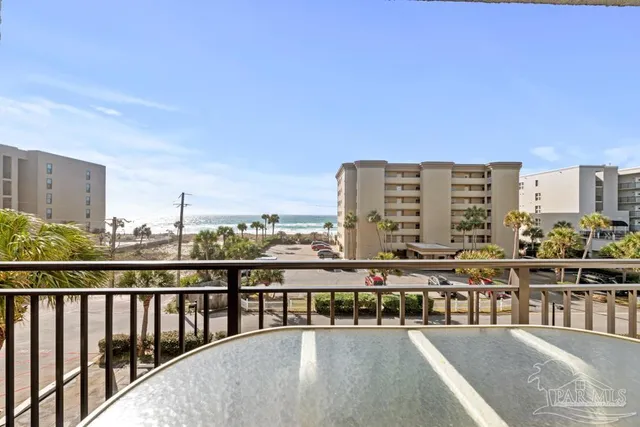 a large bed sitting in a bathroom next to a window