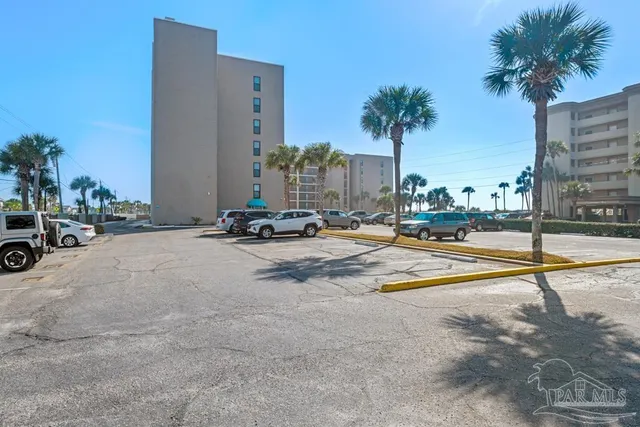 a kitchen with stainless steel appliances a sink dishwasher a stove and a refrigerator