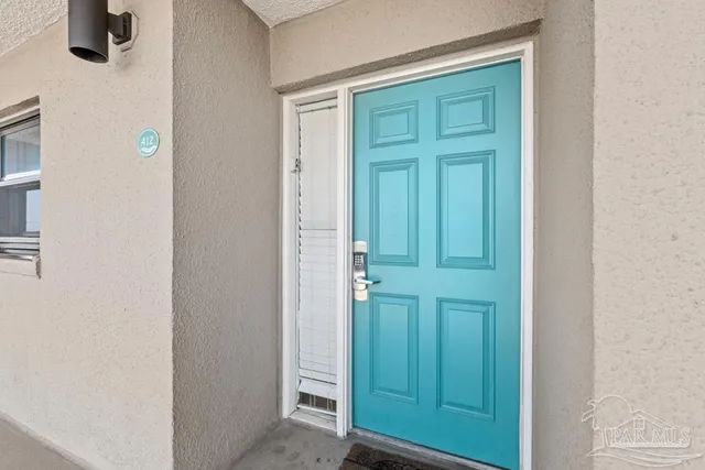 a kitchen with stainless steel appliances granite countertop a sink a stove and cabinets