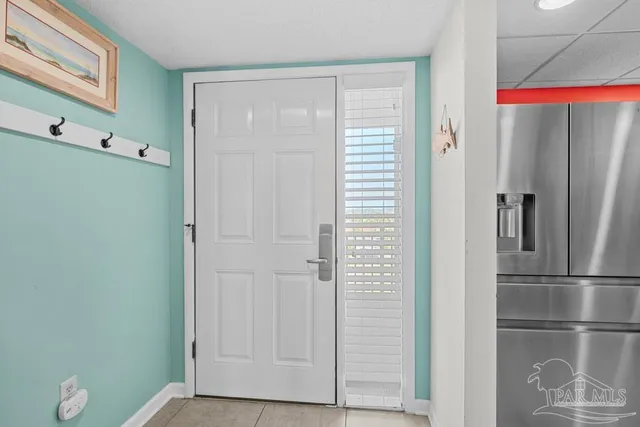 a kitchen with stainless steel appliances granite countertop a stove a sink dishwasher and cabinets with wooden floor