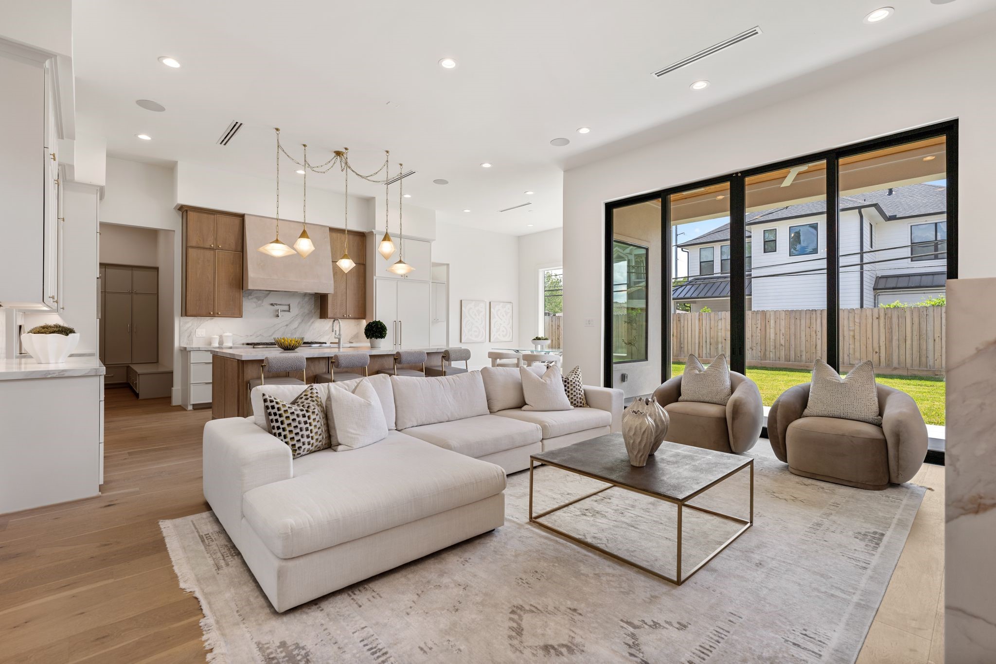 1407 Martin Street Houston, TX 77018 - Photo 16 of 44 From this angle, the symmetry of the built-ins and the height of the ceilings are fully appreciated, enhanced by designer lighting and integrated linear air vents for a clean, streamlined look.