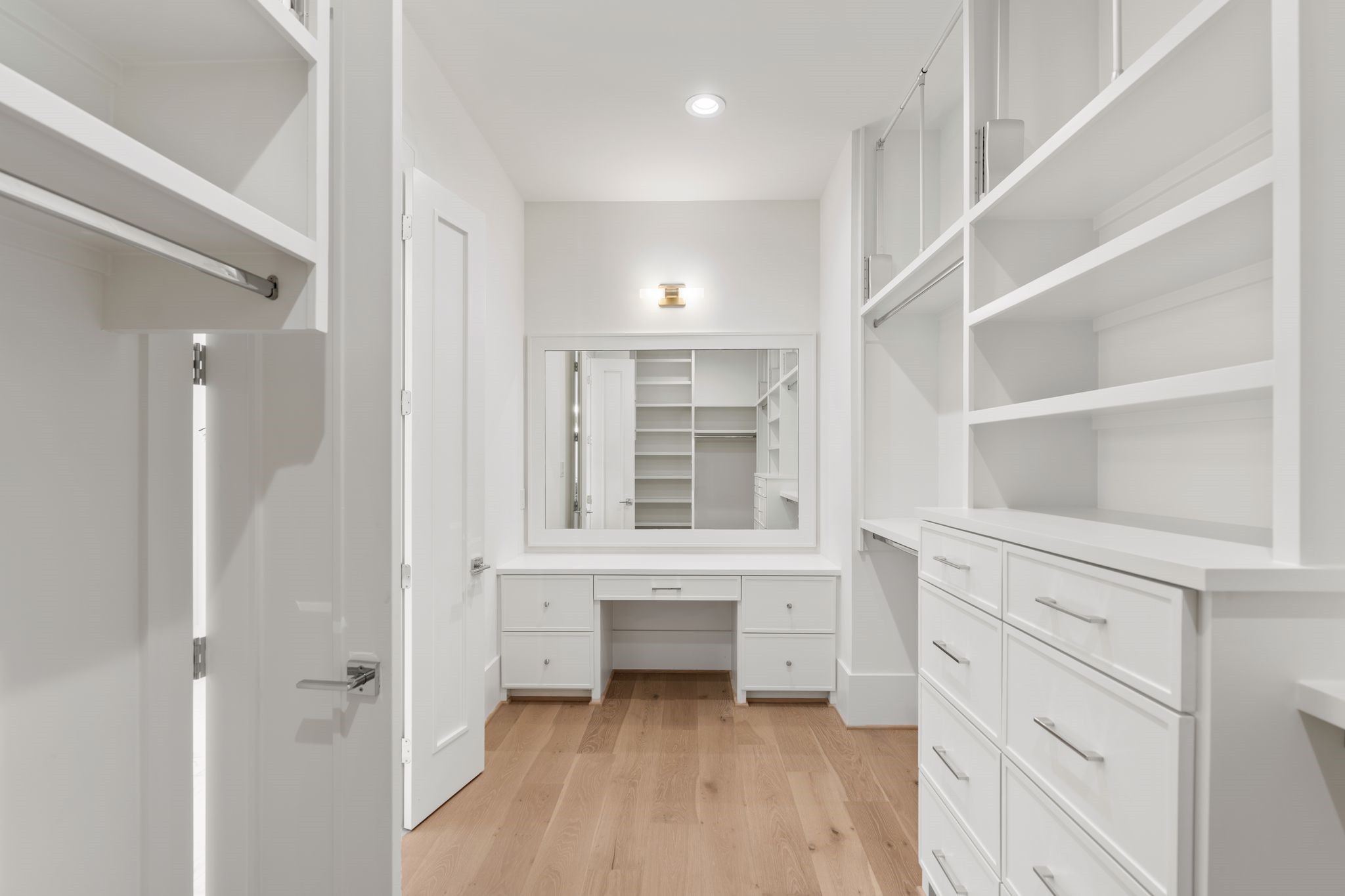 1407 Martin Street Houston, TX 77018 - Photo 37 of 44 Her oversized closet with a dedicated dressing area with a built-in vanity and mirror adds an extra layer of functionality, creating a boutique-style closet experience.