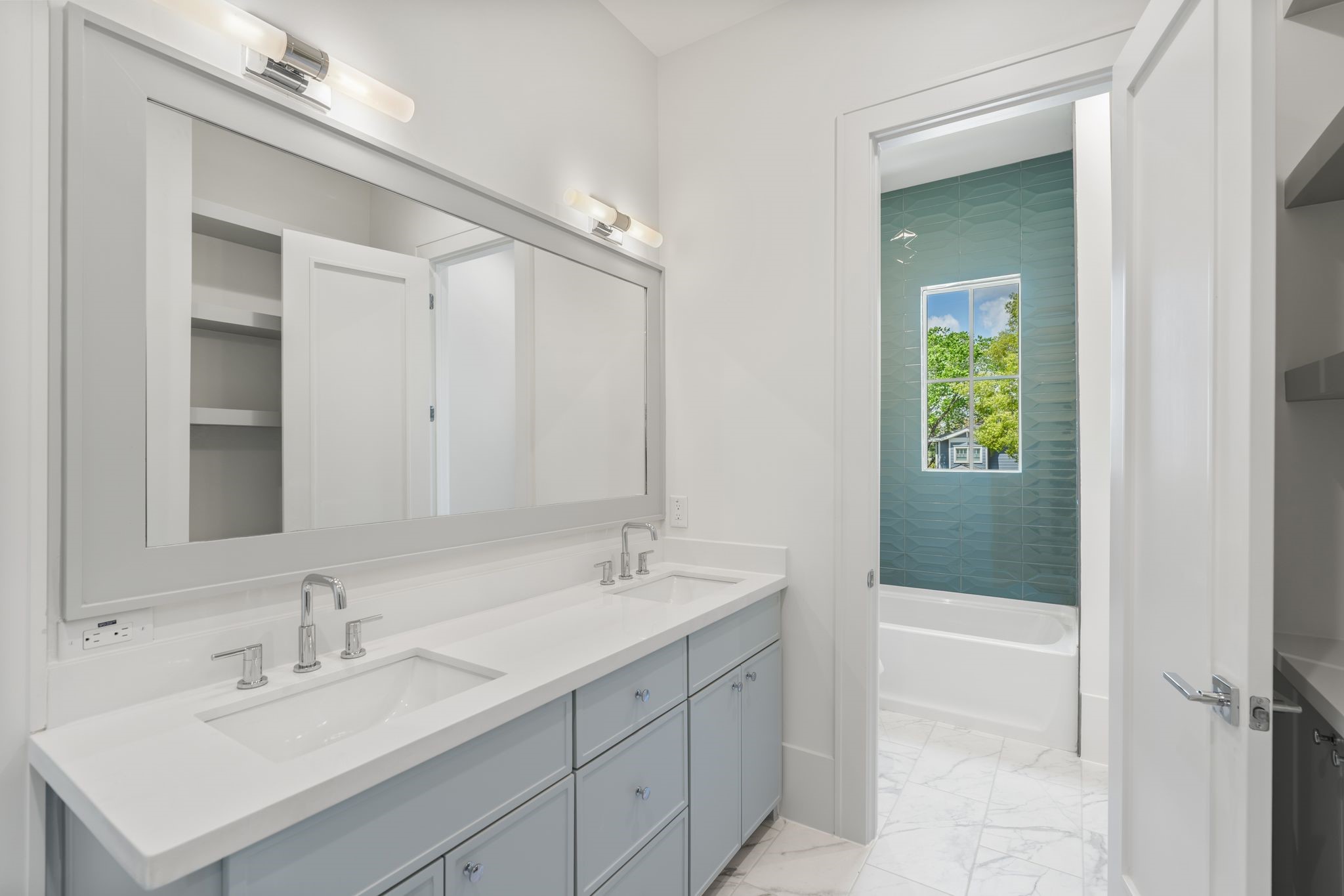 1407 Martin Street Houston, TX 77018 - Photo 39 of 44 A closer look highlights clean cabinetry lines, polished hardware, and bright lighting that enhances the crisp, contemporary design.