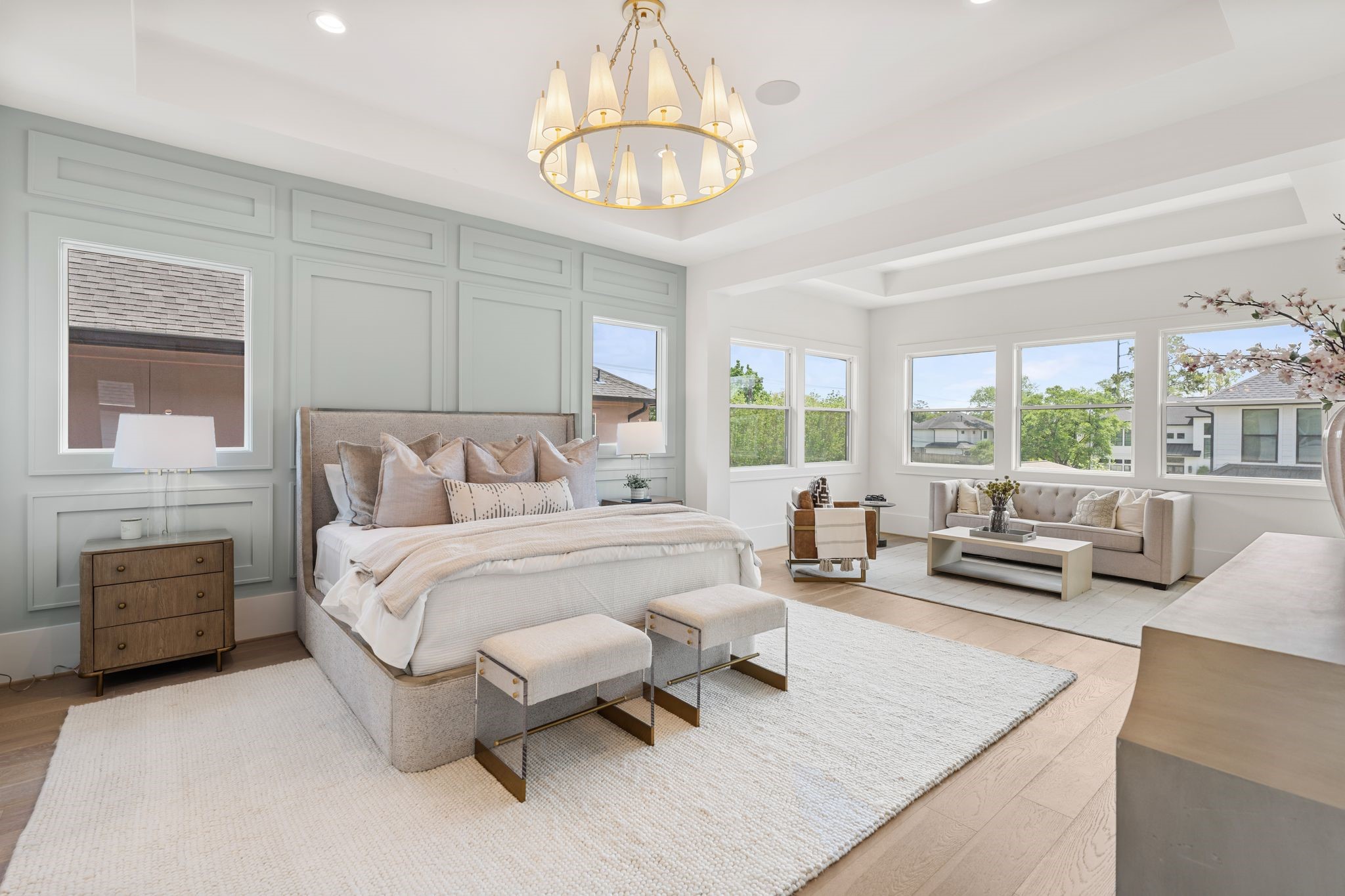 1407 Martin Street Houston, TX 77018 - Photo 6 of 44 The primary suite offers a true retreat with expansive proportions, large windows, and a sitting area, all enhanced by elevated ceiling details and designer lighting.