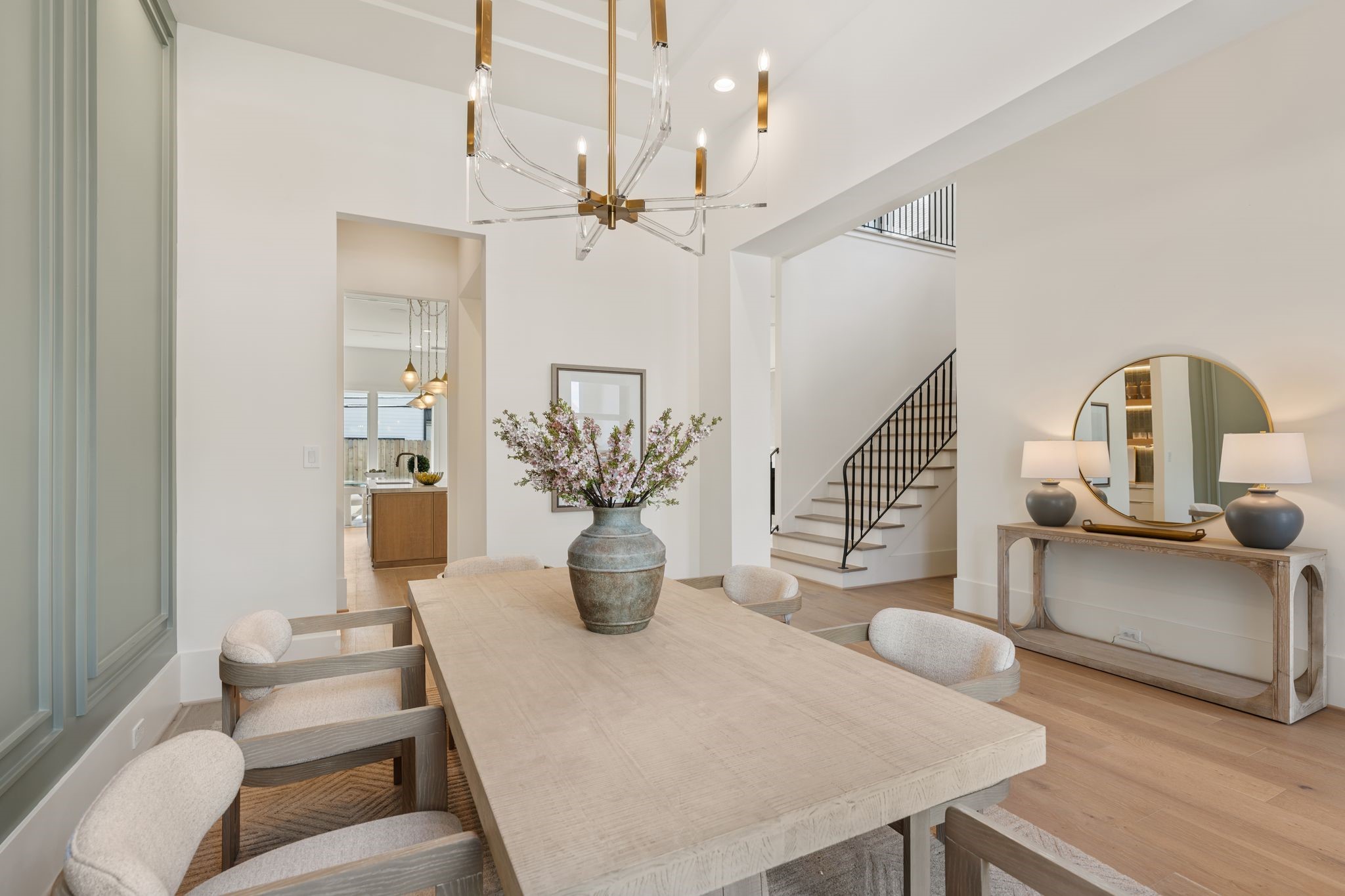 1407 Martin Street Houston, TX 77018 - Photo 9 of 44 From this perspective, the dining area connects effortlessly to the rest of the home, showcasing the open-concept design and the continuity of high-end finishes throughout.