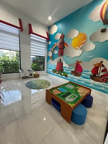 a room with pool table and window